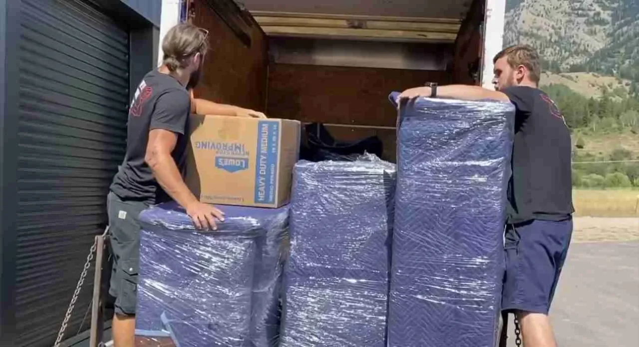 We Lift Things crew loading wrapped furniture onto the truck during a Jackson Hole move